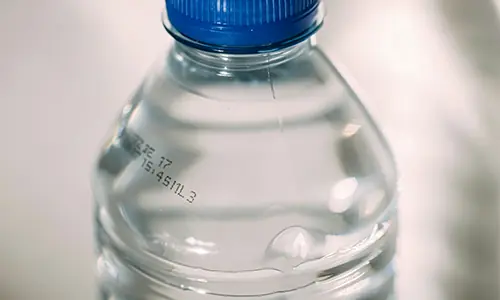 CIJ coding on PET bottles for water or juice with expiration date batch number