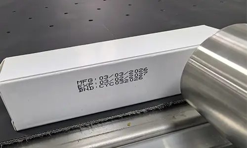 CIJ coding on paper cartons for snacks with expiry date code